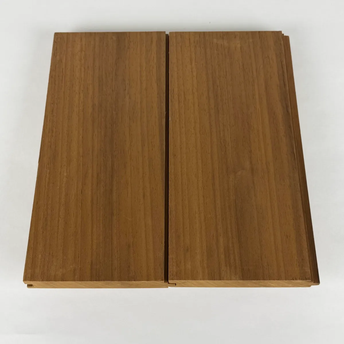 Two Nova Ambara® 1x6 tongue and groove nickel gap boards joined on a white studio background, showing the even reveal between boards.