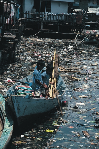Row Boat in a Sea of Plastic Trash
